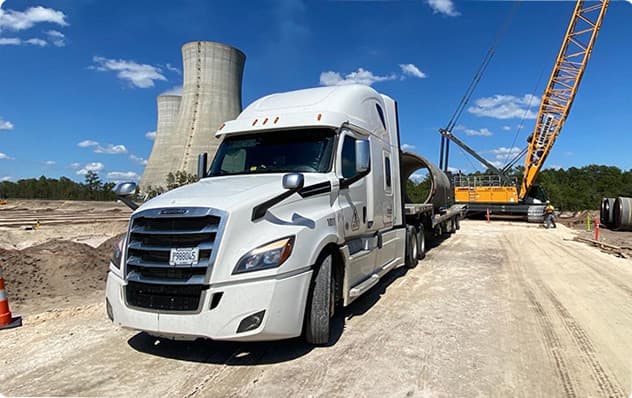 Semi truck in front of industrial facility